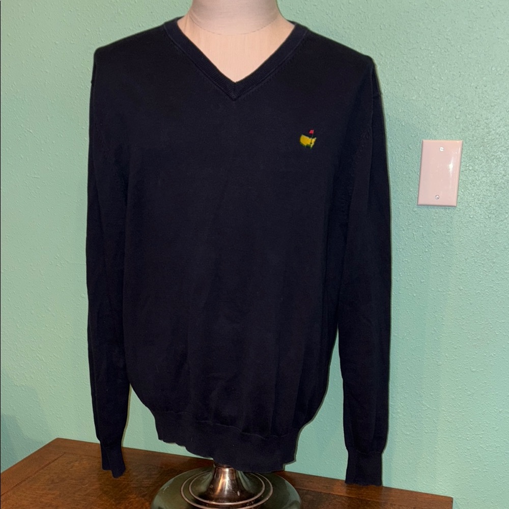 Official Masters Collection Navy Blue V-Neck Sweater. Pro-style, course ready